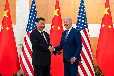 US President Joe Biden (R)  and Chinese President Xi Jinping shake hands before a meeting on the sidelines of the G20 Summit in Bali, Nov 14, 2022. (Photo | AP)