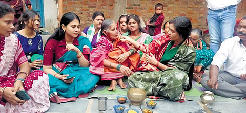 BJD candidate Barsha Singh Bariha feeding an elderly woman during her campaigning for Padampur bypoll | Express