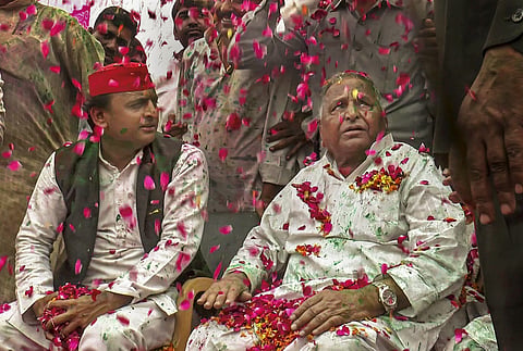 Rosy Past?: In this file image, Akhilesh Yadav is seen with his father, late Mulayam Singh Yadav. Now, rough political weather beckons the younger Yadav who has to keep the family and party together.