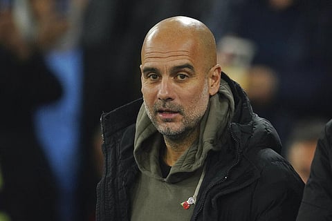 Manchester City's head coach Pep Guardiola arrives prior to the start of the English League Cup third round match against Chelsea at Etihad Stadium in Manchester, Nov. 9, 2022. (Photo | AP)