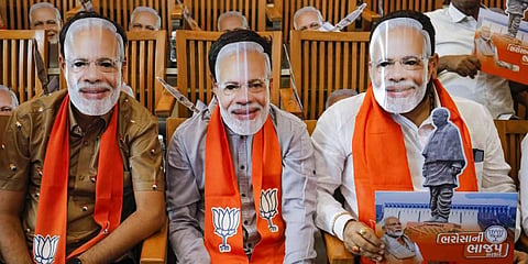 BJP workers wear mask of Prime Minister Narendra Modi in Gandhinagar. Photo used for representational purpose only. 
