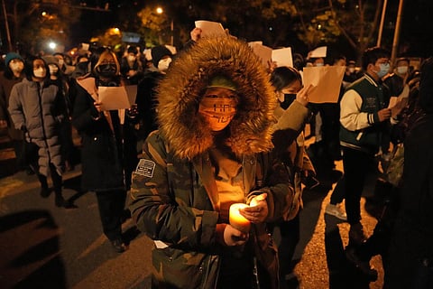 The protests against COVID-19 lockdowns have spread to Beijing even as China reported close to 40,000 coronavirus cases on Monday as authorities scrambled to contain the fresh surge in infections. (Photo | AP)