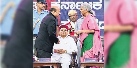 CM Basavaraj Bommai interacts with Union Finance Minister Nirmala Sitharaman in the presence of Governor Thaawarchand Gehlot at the Global Investors Meet 2022,  in Bengaluru on Wednesday | Shashidhar