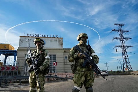 Russian soldiers guarding the Kakhovka Hydroelectric Station (Photo | AP)