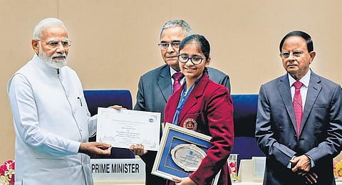 PM Narendra Modi presents a prize to a student during the launch of ‘Complaint Management System’ portal of Central Vigilance Commissionn in New Delhi. (Photo | PTI)