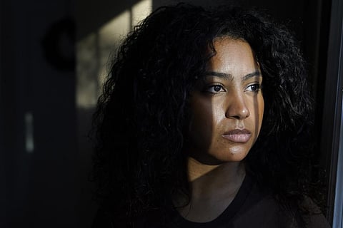 Pariss Chandler, of Randolph, Mass., founder of the recruitment platform website Black Tech Pipeline, sits for a photograph at her home, Thursday, Nov. 3, 2022. (Photo | AP)