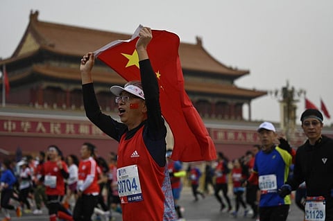 Runners take part in the Beijing Marathon in the Chinese capital on November 6, 2022. (Photo | AFP)