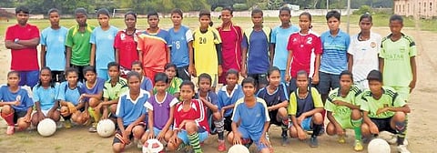 Women footballers of Aul pose for a photograph  | Express