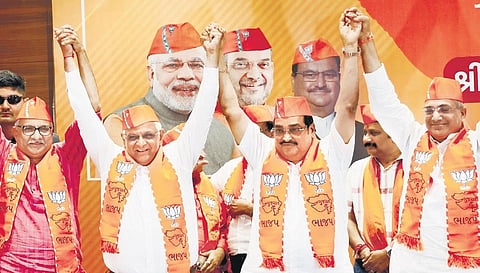 Gujarat Chief Minister and BJP candidate Bhupendra Patel with party’s state president CR Patil and other leaders in Gandhinagar on Thursday. (Photo| PTI)