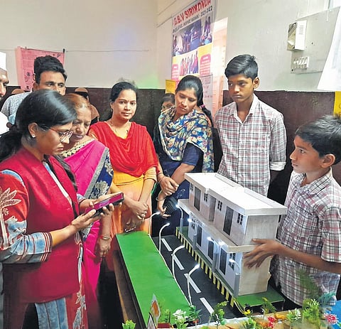 District Collector Sikta Patnaik interacts with students at the district-level science exhibition in Adilabad on Saturday. (Photo | EPS)