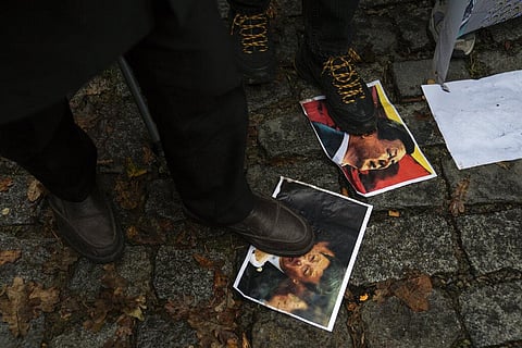 Protesters step on pictures of  Xi Jinping during a protest against China's brutal crackdown on Uyghurs, in front of the Chinese consulate in Istanbul, Turkey, Nov. 30, 2022. (File Photo | AP)