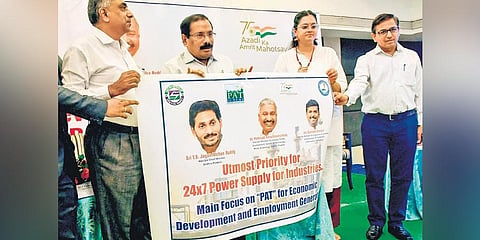 Special Chief Secretary (Energy) K Vijayanand releases a poster at a workshop on the PAT Scheme in Vijaya. (File photo | Prasant Madugula, EPS)