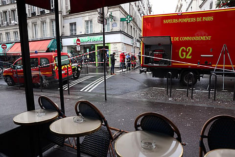 Police tape is used to cordoned off the area following a shooting along rue d'Enghien in the 10th arrondissement, in Paris on December 23, 2022. (Photo | AFP)