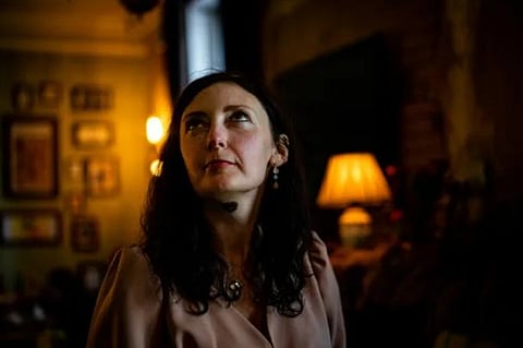 Julia Kirkina poses before playing piano in a cafe-restaurant in Mykolaiv, amid the Russian invasion of Ukraine. (Photo | AFP)