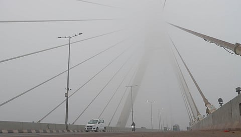 A scene of Signature bridge where fog covered the whole area, in New Delhi. (Photo |  Shekhar Yadav, EPS)