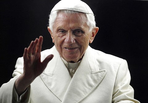 Pope Benedict XVI blesses the faithful as he arrives in St. Peter's Square at the Vatican to bless the nativity scene on Dec. 31, 2011. (Photo | AP)