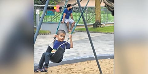 A child playing on a swing at the redeveloped Kunnara Park  | Express