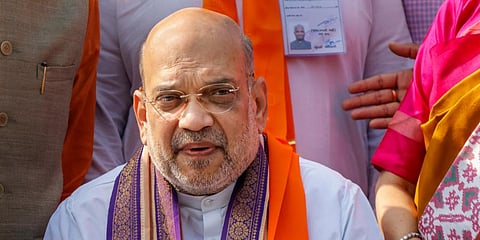 Union Home Minister Amit Shah addresses the media after casting his vote at a polling booth during the second and final phase of Gujarat Assembly elections. (Photo | PTI)