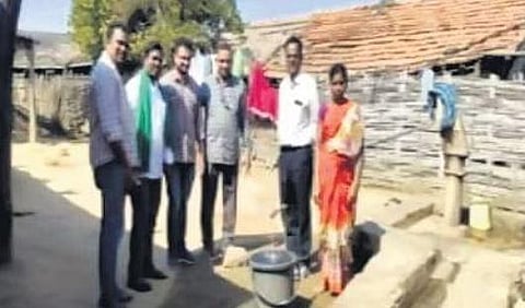 A woman draws water from a Mission Bhagiratha tap in an Adilabad village