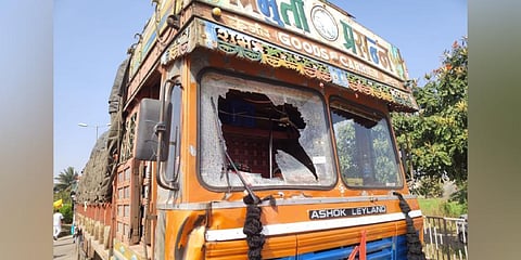 Trucks bearing the Maharashtra registration were stopped, smeared with black ink and pelted with stones. (Photo | Special Arrangement)