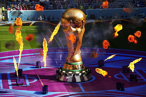 A giant copy of the trophy is displayed prior to the World Cup group G match between Cameroon and Serbia, at the Al Janoub Stadium in Al Wakrah, Nov. 28, 2022. (Photo | AP)