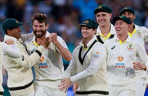 Australia's Michael Neser, second left, celebrates with teammates on the second day of their cricket test match in Adelaide. (Photo | PTI)