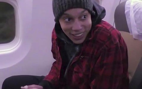 In this image made from video provided by Russian Federal Security Service, Brittney Griner sits in the plane as she flies to Abu Dhabi to be exchanged for Viktor Bout, in Russia. (Photo | AP)