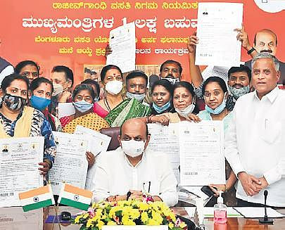 CM Basavaraj Bommai launches the housing scheme for beneficiaries in Bengaluru on Monday, as Housing Minister V Somanna  looks on | Express