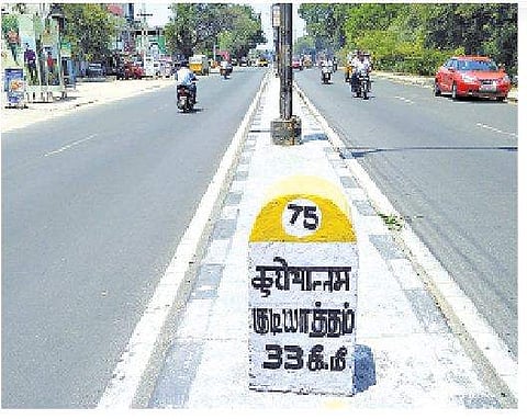 A milestone reads Gudiyattam in Hindi and Tamil. (Photo| S Dinesh)