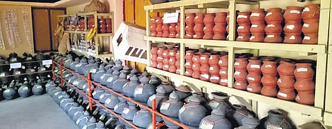 Paddy seeds stocked in earthen pots in the seed bank