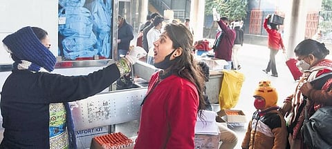 A health worker takes swab sample for Covid test on Sunday, Feb 13, 2022. (Photo | EPS, Parveen Negi)