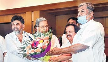 Congress leader DK Shivakumar, Siddaramaiah and BK Hariprasad at the CLP meeting in Bengaluru on Monday
