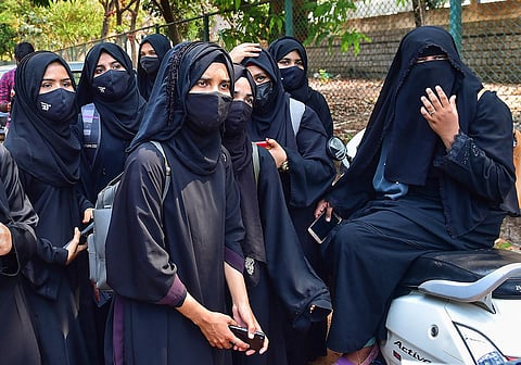 Students leave after they were not allowed to attend classes while wearing Hijab, at Dr G Shankar Government Women's First Grade College in Udupi. (Photo | PTI)