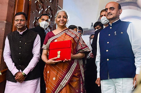 Union Minister of Finance Nirmala Sitharaman with Ministers of State for Finance Bhagwat Kishanrao Karad and Pankaj Chaudhary on her at Parliament for the presentation of the Union Budget 2022-23, in