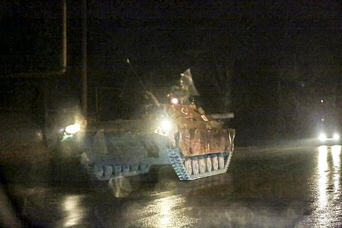 An armored vehicle rolls down a street outside Donetsk, the territory controlled by pro-Russian militants, eastern Ukraine, late Tuesday, Feb. 22, 2022. (Photo | AP)