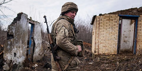 A serviceman stands at his position at the line of separation between Ukraine-held territory and rebel-held territory near Svitlodarsk, eastern Ukraine. (Photo| AP)
