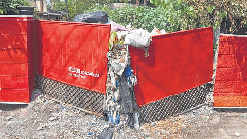 Huge heap of garbage bulging out of a private property near Tax Tower at Karmana in Thiruvananthapuram. Waste accumulation is posing serious health problems for the local residents | B P Deepu