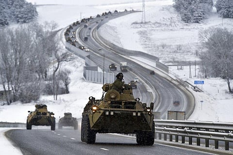 A convoy of Russian armored vehicles moves along a highway in Crimea, Tuesday, Jan. 18, 2022. (Photo  | AP)