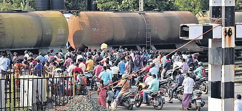 People crossing the level crossing at Korukupet station | P Jawahar
