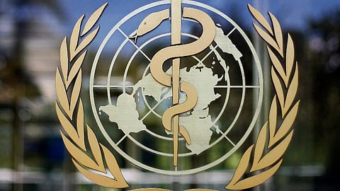 The logo of the World Health Organization is seen at the WHO headquarters in Geneva, Switzerland. 
