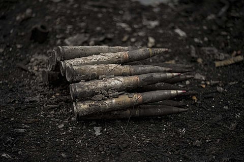 Large caliber ammunition lies on the ground next to a destroyed Russian tank in Irpin, Ukraine.  (Photo | AP)