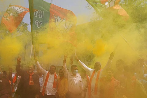 Supporters of India's rolling Bharatiya Janata Party(BJP) celebrate after their party's victory in state elections, in Ahmedabad. (Photo | AP)