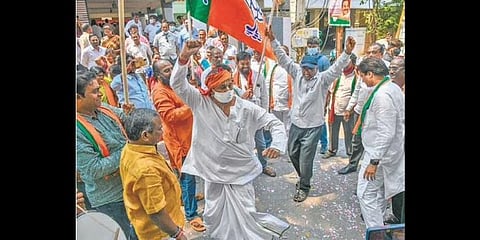 BJP cadre celebrate the victory of the party in the elections in four states,  at its state office in Vijayawada on Thursday (Photo I Prasant Madugula)