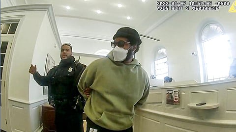 A police officer detains 'Black Panther' director Ryan Coogler at a Bank of America branch in Atlanta. oogler was mistaken for a bank robber at the bank. ( Photo | AP)