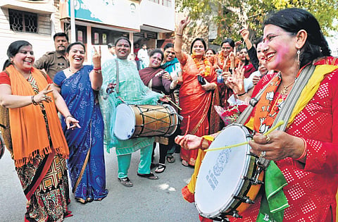 Women party workers celebrate BJP’s win in Moradabad on Friday. (Photo | PTI)