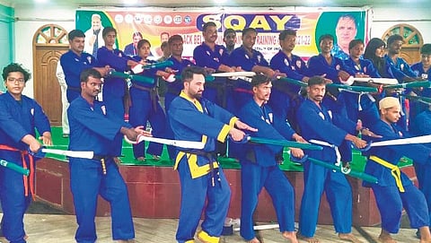 Students performing Sqay, a Kashmiri martial art, in Nellore city during a competition | Express