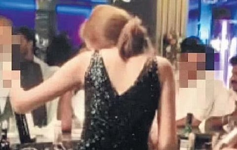Women serving liquor in bar | video grab