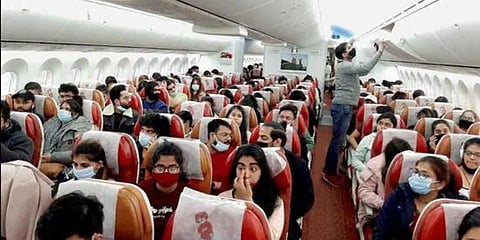 Indian nationals board a special Air India flight, evacuating Indians from war-torn Ukraine, in Bucharest. (Photo | PTI)
