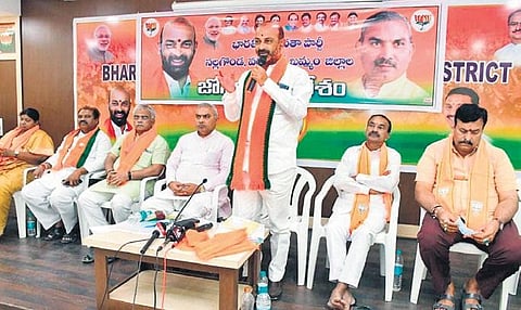 BJP State president Bandi Sanjay Kumar addresses party workers during a meeting  in Nalgonda town on Saturday as other leaders look on