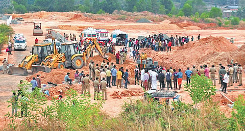 Firefighters and police officers rescuing the people who were trapped after a portion of a land at the Nest group’s construction site at Kalamassery caved in on them on Friday | file pic